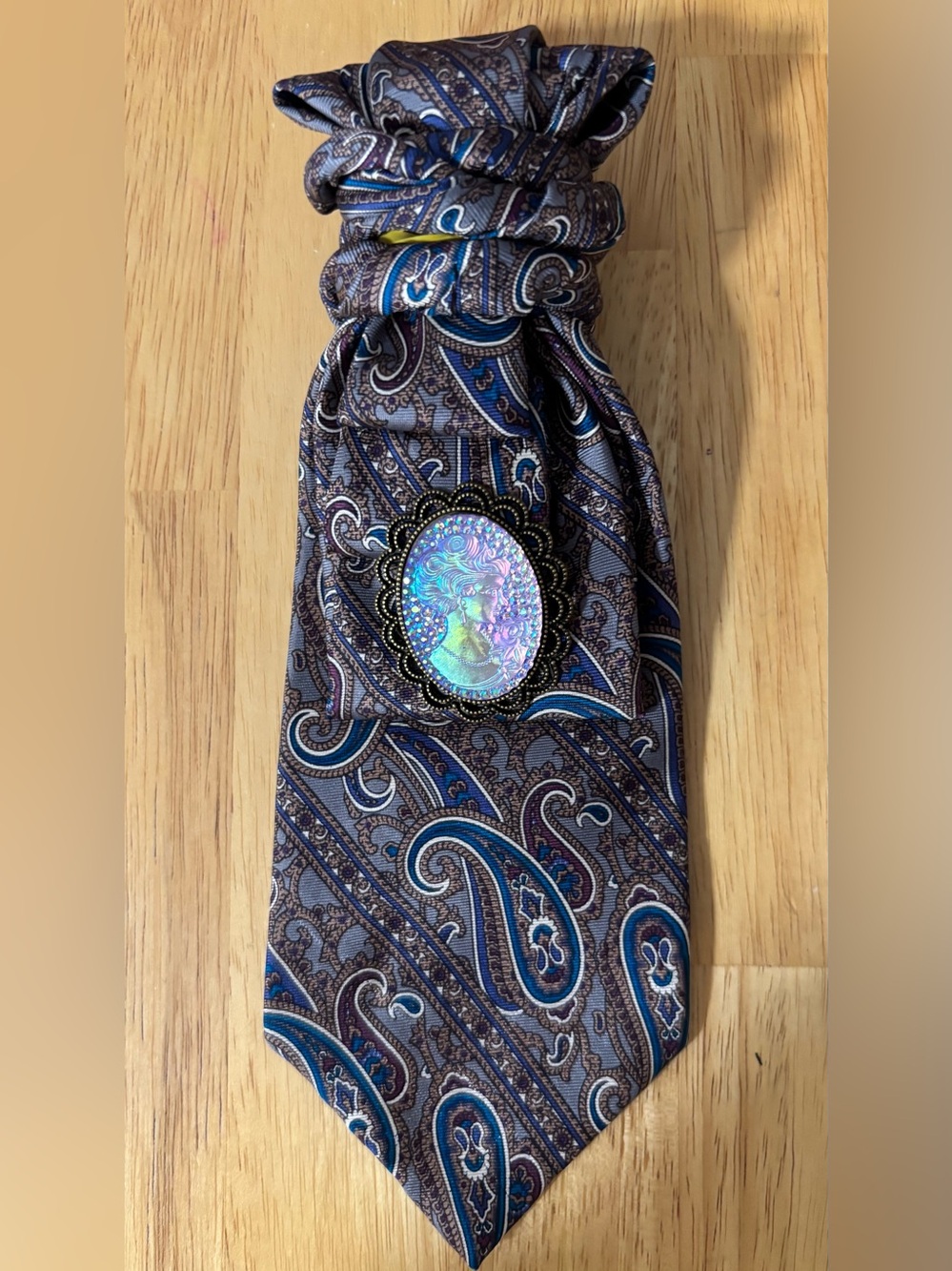 Elegant Blue Paisley Men's Necktie with Iridescent Cameo Pin